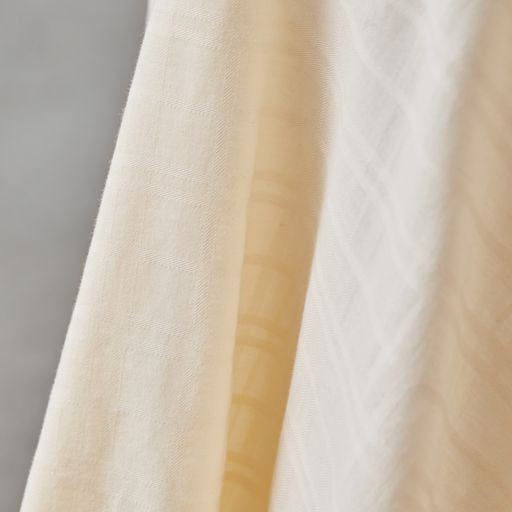 Light and silky soft sheer voile with woven grid texture. Shell