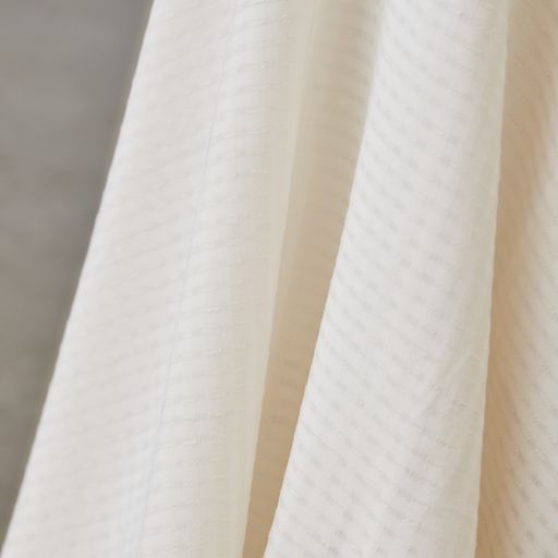 Light and sheer voile with a fine checkered texture. Creamy white