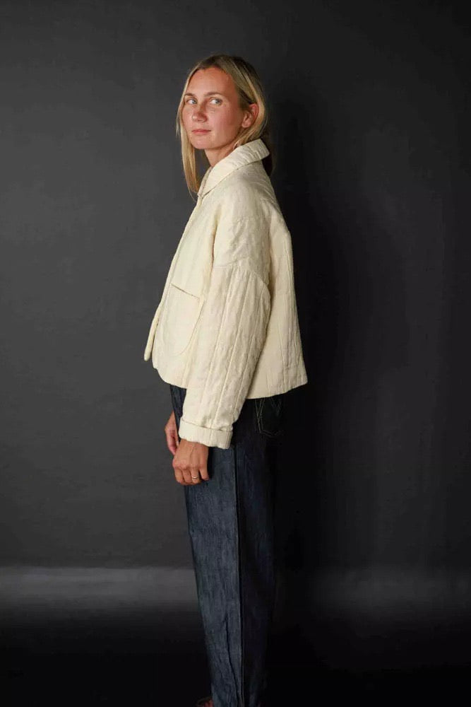 Sasha is wearing the Sanda jacket in Natural Jacquard Cotton. Sasha is a 10, and is wearing a size 10. 