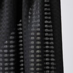 Light and sheer with a fine woven check texture. Black
