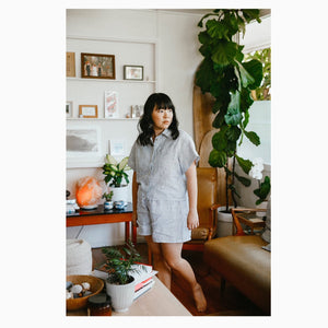 
                
                    Load image into Gallery viewer,  Faith wears a stripped linen short sleeve, size 12, paired with matching Pipit Loungewear Set shorts.
                
            