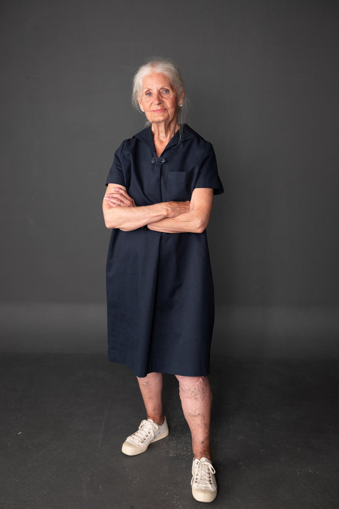 Brenda is wearing the dress in Navy Sanded Twill , she is a size 10 and 5.2.