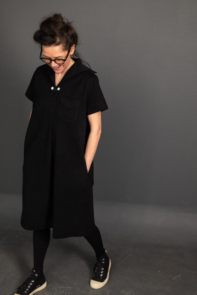 Katie is wearing the dress in 12oz Organic Black Twill she is a size 8 and is 5.4.