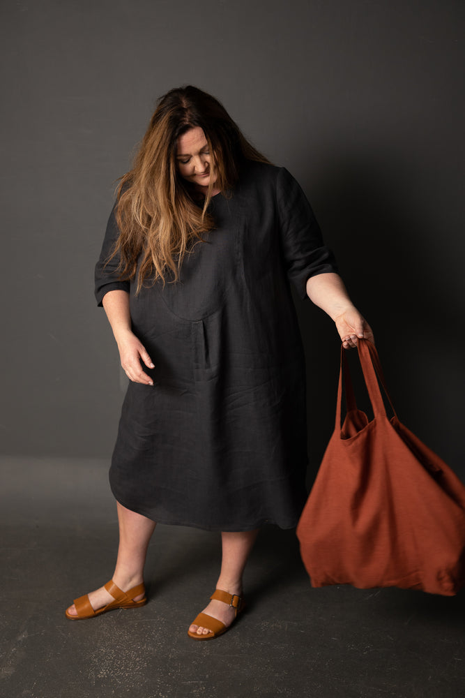 Clare is wearing a Dress Shirt in Scuttle Black 185 linen, and is wearing a size 26.