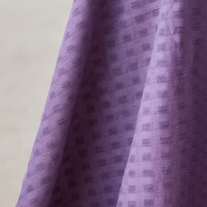 Light and sheer with a fine woven check texture. Mauve colourway.